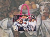 Still Life with Apples and Oranges, a masterpiece by Paul Cézanne in 1899, showcased in detail on high-end handbag via video.