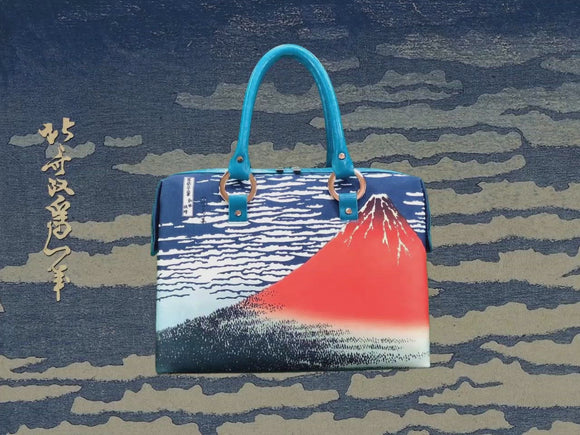 “Red Fuji” or “Fine Wind, Clear Sky” (富嶽三十六景　凱風快晴), a Ukiyo-e masterpiece by Hokusai (葛飾 北斎), shown in detail on high-end handbag via video.
